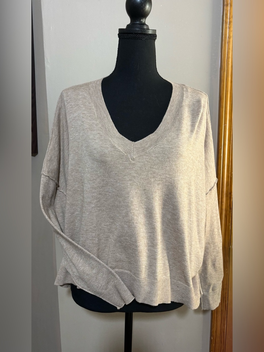 Women’s high low v neck sweater. Size S. NWT. Sleeve and shoulder details.